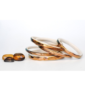 Liquorice Moon Studios’ copper ceramic bangle AU$35 each - Etsy