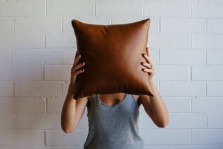 Tan leather cushion by Mr & Mrs White via WeeBirdy.com