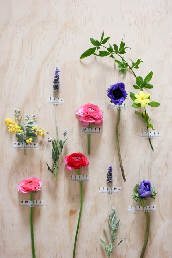 Decorate your walls for a party with single fresh flowers and tape, via WeeBirdy.com