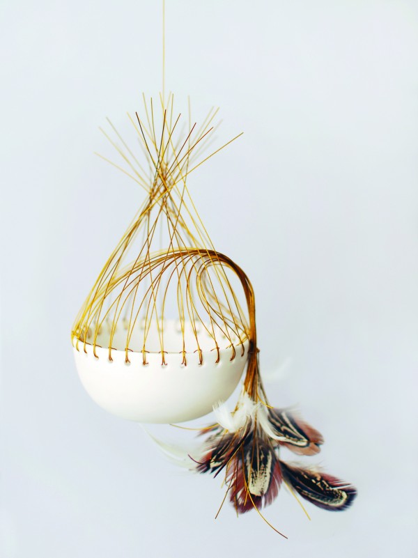 Porcelain, feathers and copper wire vessel by Lisa Tilse. 