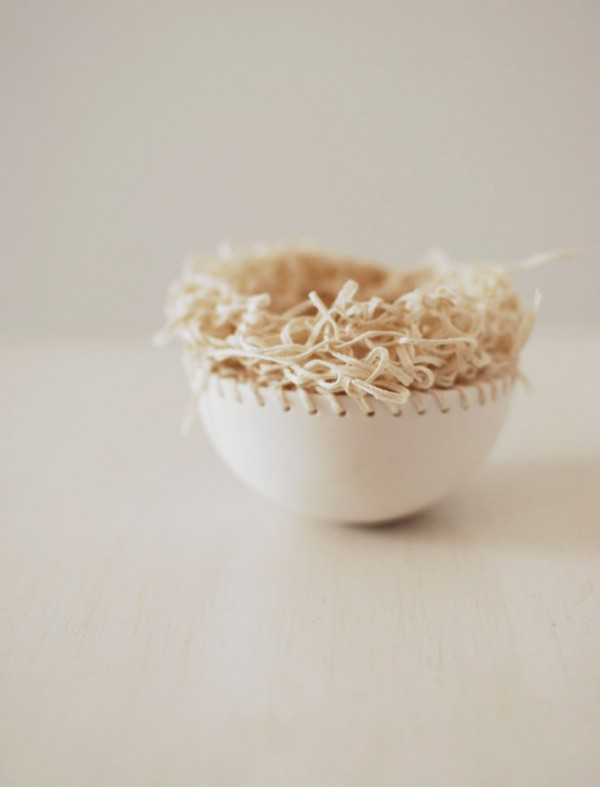 Paper yarn and porcelain vessel by Lisa Tilse. 