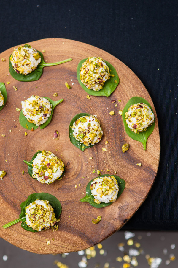 Super-easy Christmas entertaining: pistachio-covered goats cheese balls, on Rustic Serving Board from Freedom. Christmas entertaining at home with Wee Birdy, via WeeBirdy.com.