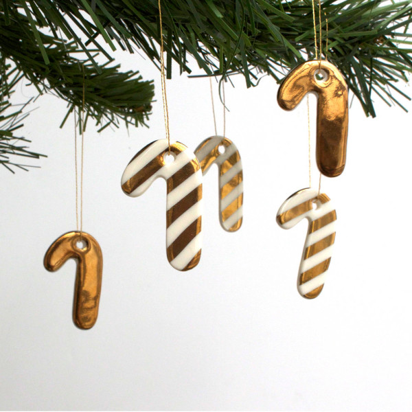 Mini candy cane gold lustre porcelain Christmas ornaments $58.11, from Jo Heckett's Etsy shop.