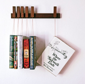 25 Excellent Presents for Book Lovers, via WeeBirdy.com: Custom-made wooden book rack, $129.21 from Agustav's Etsy shop.