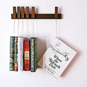25 Excellent Presents for Book Lovers, via WeeBirdy.com: Custom-made wooden book rack, $129.21 from Agustav's Etsy shop.