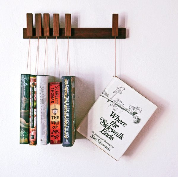 25 Excellent Presents for Book Lovers, via WeeBirdy.com: Custom-made wooden book rack, $129.21 from Agustav's Etsy shop.