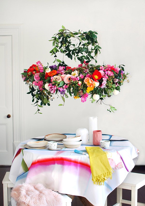Save money and florist costs by making your own incredible flower chandelier. Tableware and vessels all Lisa's own: Fold Unfold tablecloth by HAY; Tea towels used as napkins by Mark Tuckey for Cotton On; Speckled vessels by Katia Carletti; Lisa’s mum’s white vintage glass vases; pink vessel by the Mod Collective; plates and bowls by Kim Wallace. Photo: Lisa Tilse for We Are Scout