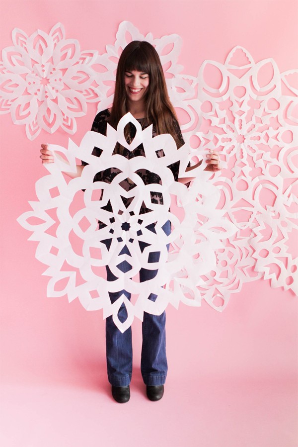Make paper giant snowflakes by Oh Happy Day. 