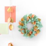 22 Clever and Creative Christmas Craft Tutorials Make a paper wreath by Lisa Tilse for We Are Scout.