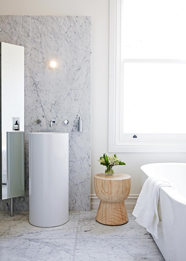 Adding a touch of natural texture to this marble and ceramic bathroom. Photo by Sean Hennessy, via Homes to Love. 