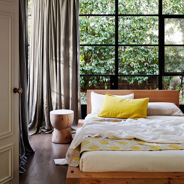 Here, the eggcup is used as a bedside table in this stylish bedroom. Photo via Temple & Webster.