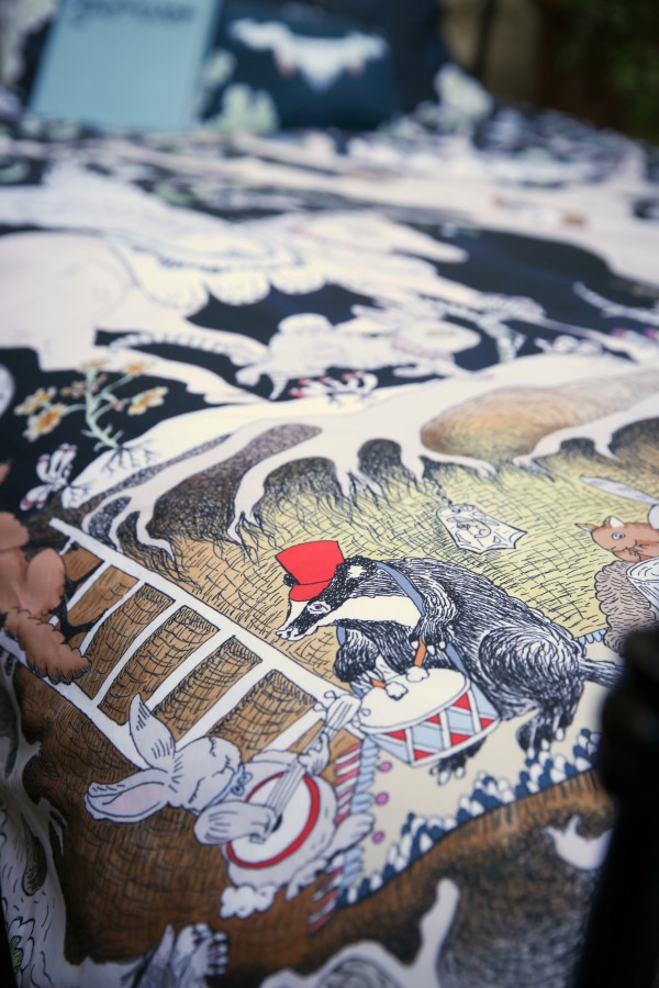 Detail of Forivorland side of Enchanted Forest design showing Cassius the Badger playing the drums.