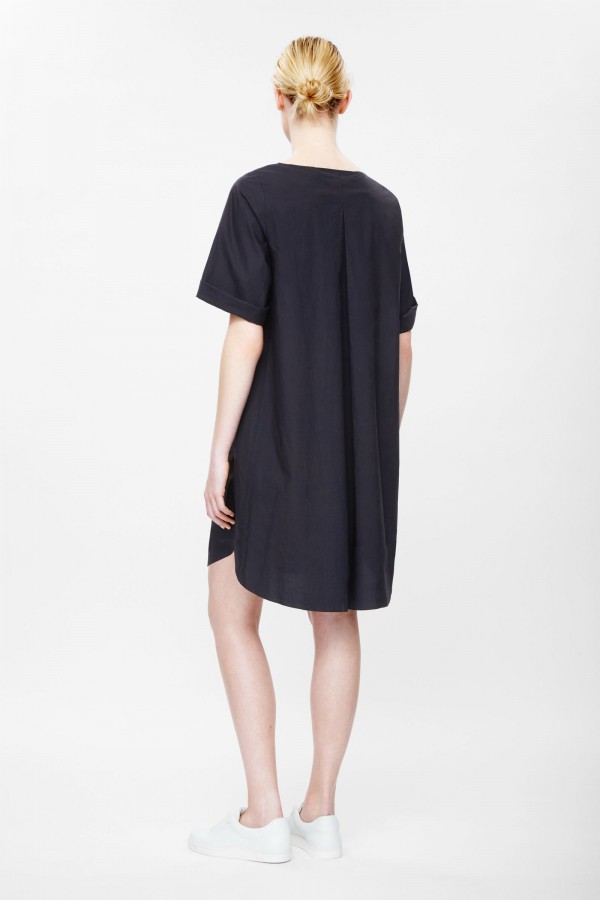Pleated back dress, available in navy and green, £59, from COS.