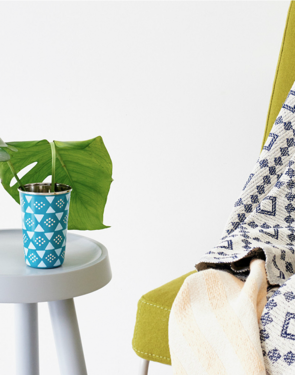 Add a tribal hand-painted element to your space with this enamel tumbler by Sage and Clare.