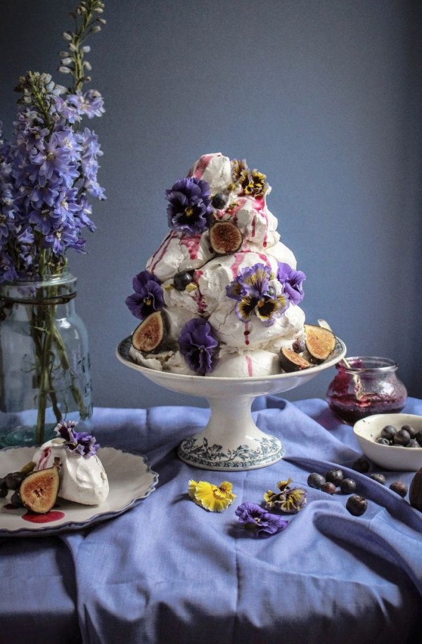Earl Grey pistachio meringue tower with blueberries and figs and edible flowers by Twigg Studios.