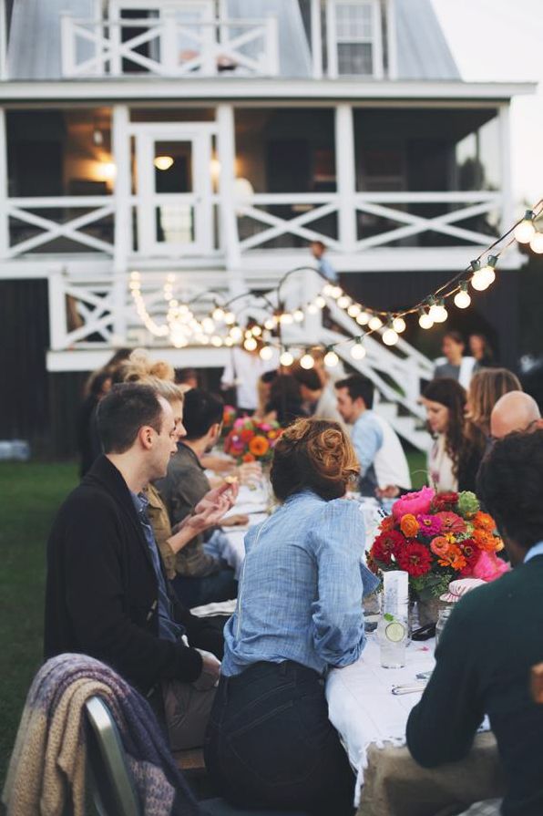 Dining under string lights at a Kinfolk celebration. Photo by Olivia Rae James.