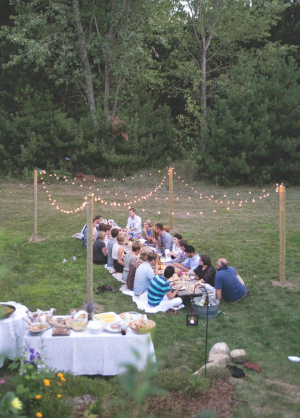 A simple dinner party made magical with globe string lights, via The Fresh Exchange.