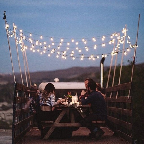 String lights add a touch of magic to this dining table - truck style.