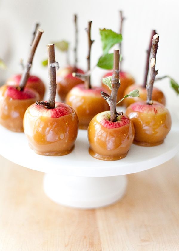 Caramel apples with twig stems by The Broke Ass Bride. 