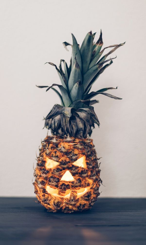 Carved pineapple Jack-'o-lantern by A Subtle Revelry.