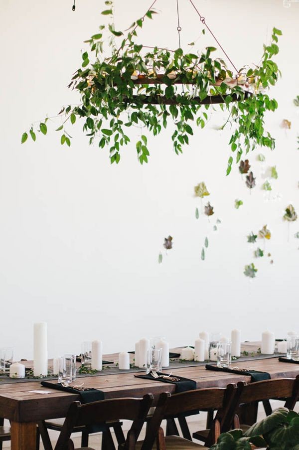 Make a beautiful hanging wreath with foraged foliage, like this table setting at Emily and Tim's wedding, via Once Wed.