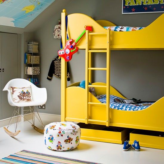 Room for two with a bright yellow bunk bed via House to Home. The children have bed linen with different prints in matching tones.