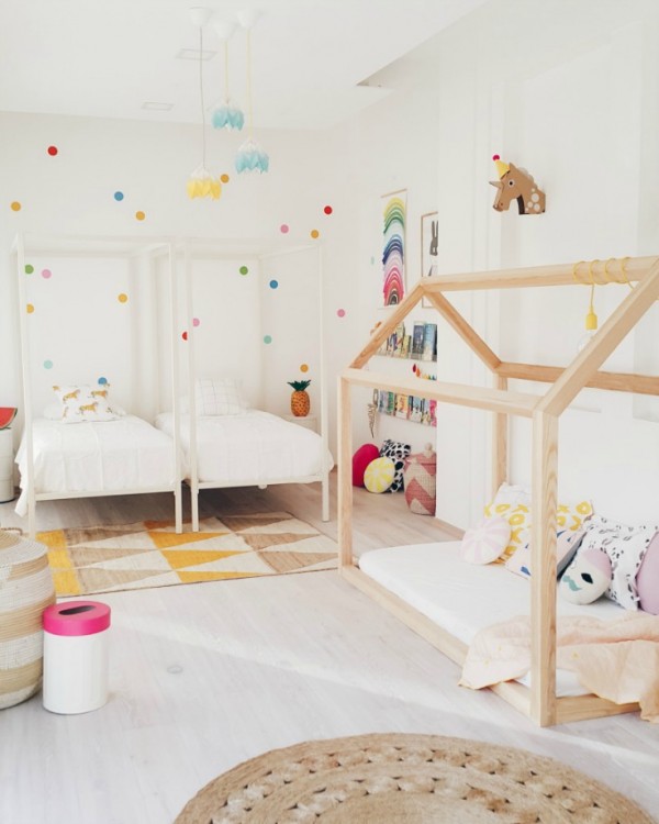 A light and bright room for two, with a bonus timber house day bed/cubby, via Live Loud Girl.