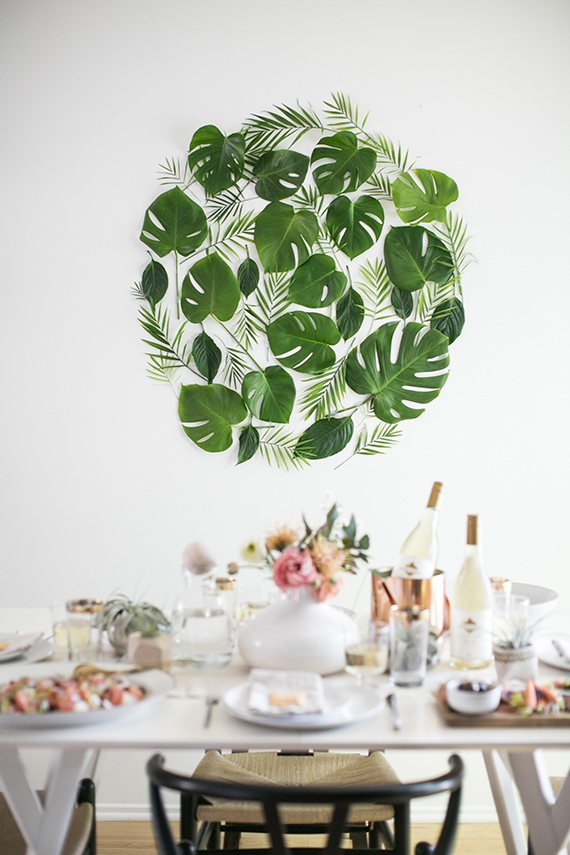 A DIY Leaf backdrop for a dinner party by Almost Makes Perfect.