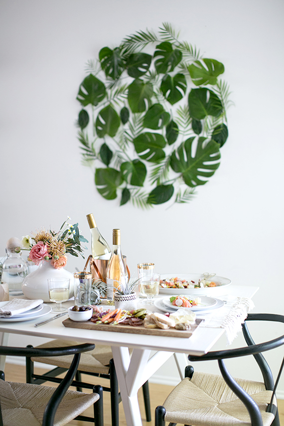 Gorgeous green leaf backdrop set the scene for this table via Almost Makes Perfect. 
