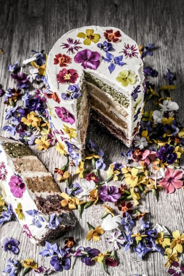 Natural coloured rainbow cake with edible flowers by Twigg Studios.