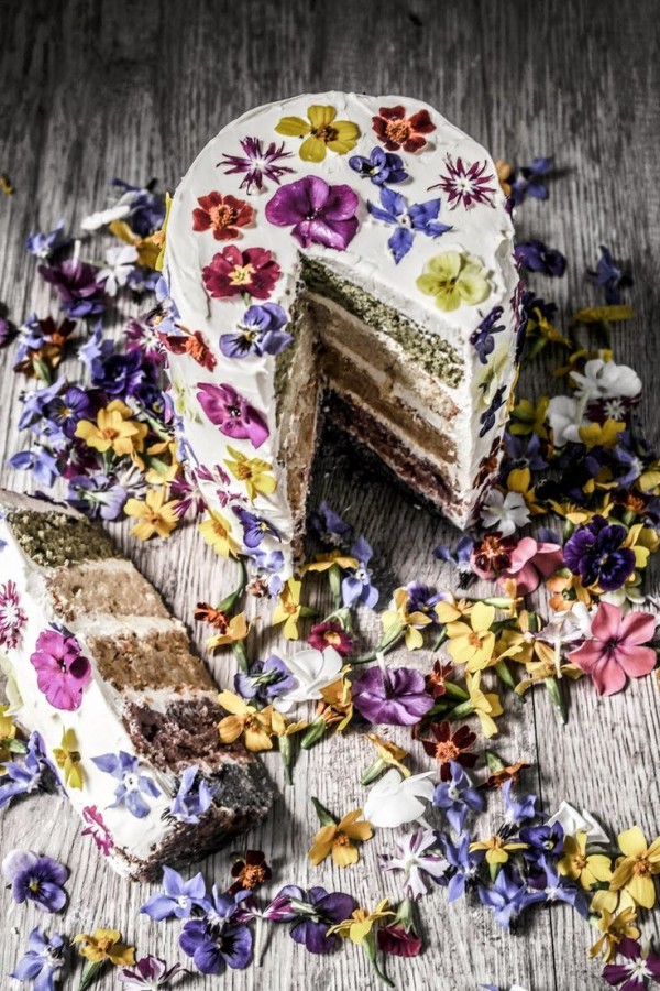 Natural coloured rainbow cake with edible flowers by Twigg Studios.