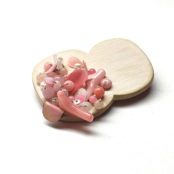 Brooch with coral, pearls, moonstone and jade by Melinda Young.