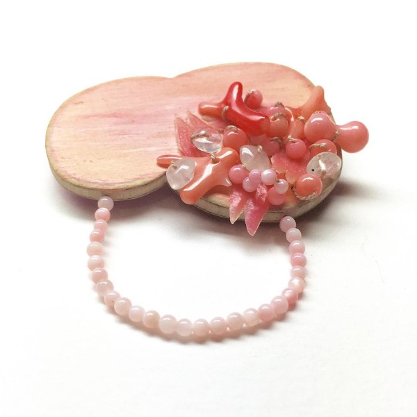 Brooch with coral, pearls, moonstone and jade by Melinda Young.