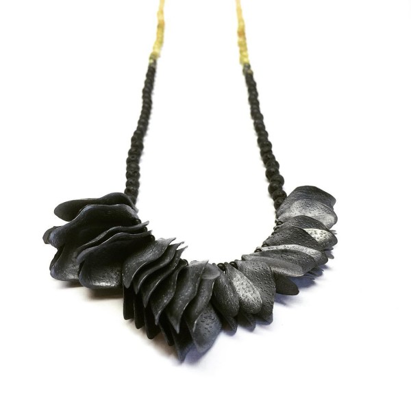 Graduated petals neck piece by Melinda Young, in oxidized silver, agate, jasper, jade, onyx, and stone.