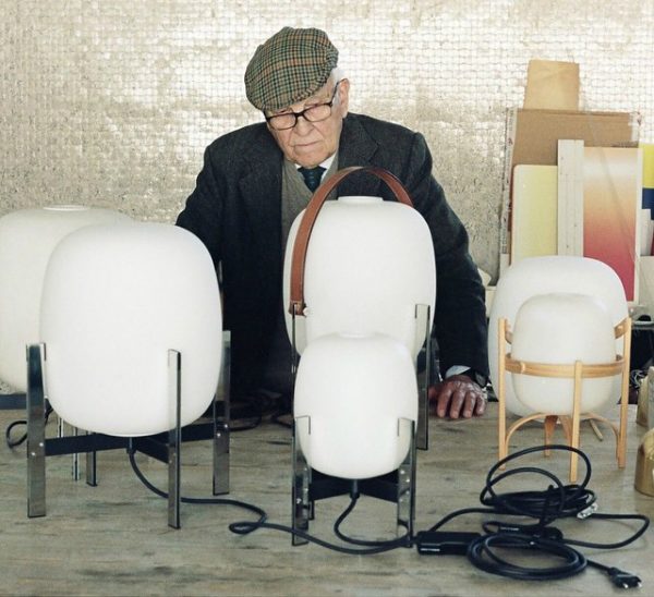 Miguel Milá with his iconic Cesta lamp. Photography courtesy of Santa & Cole.